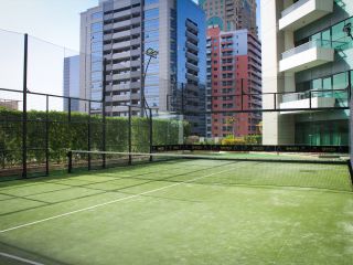 A Tennis Court In Front Of A Building